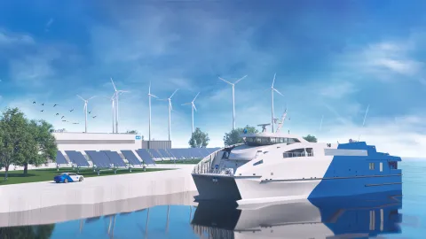 Blue and white ferry in the foreground on the water with solar panels on the dock to the right with wind turbines in the background