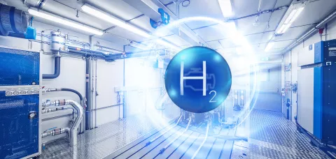"H2" in a blue bubble in front of a heavy duty emissions testbed