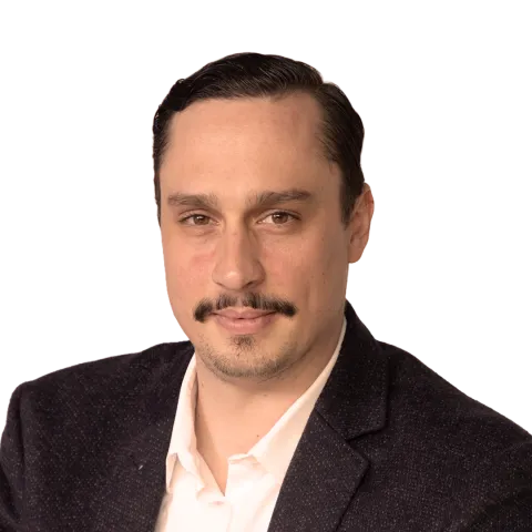 headshot of Daniel Ritzberger wearing a white shirt and suit jacket