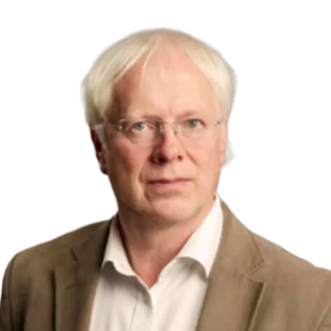 headshot of John Irvine wearing a white shirt and brown suit jacket