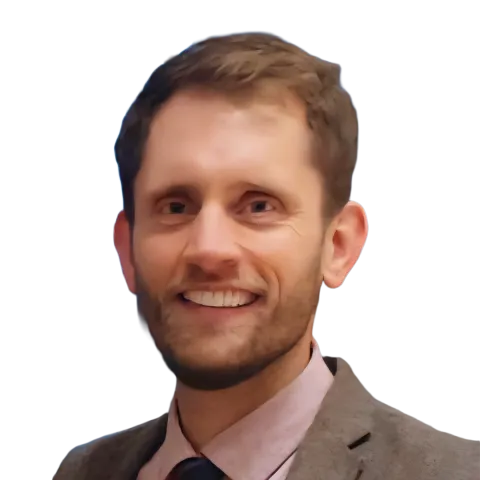 headshot of Matthew Parker wearing a brown suit jacket